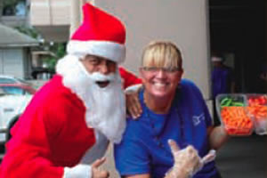 ohg1220_5 Santa with Greta Richardson of Prudential Locations