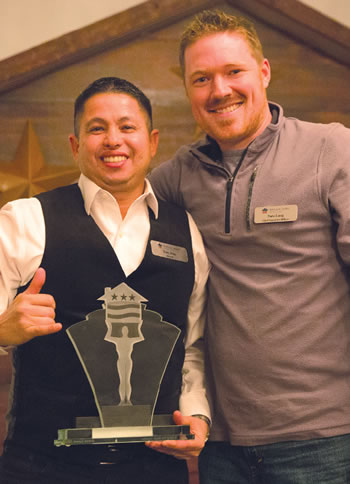 Veterans United Home Loans of Hawaii Branch Manager Tony Dias (left) with national CEO Nate Long at the award presentation