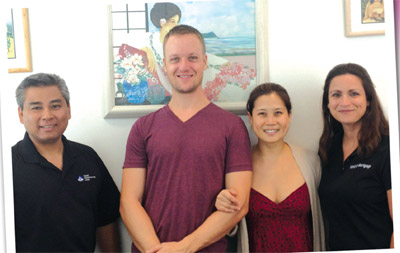 Left to right: Dale Tomei, Hawaii HomeOwnership Center Education Coordinator & the Goodiers' homeownership coach; homeowners Rob and Silver Goodier; Rachel Willis, HHOC Mortgage & the Goodiers' loan officer.